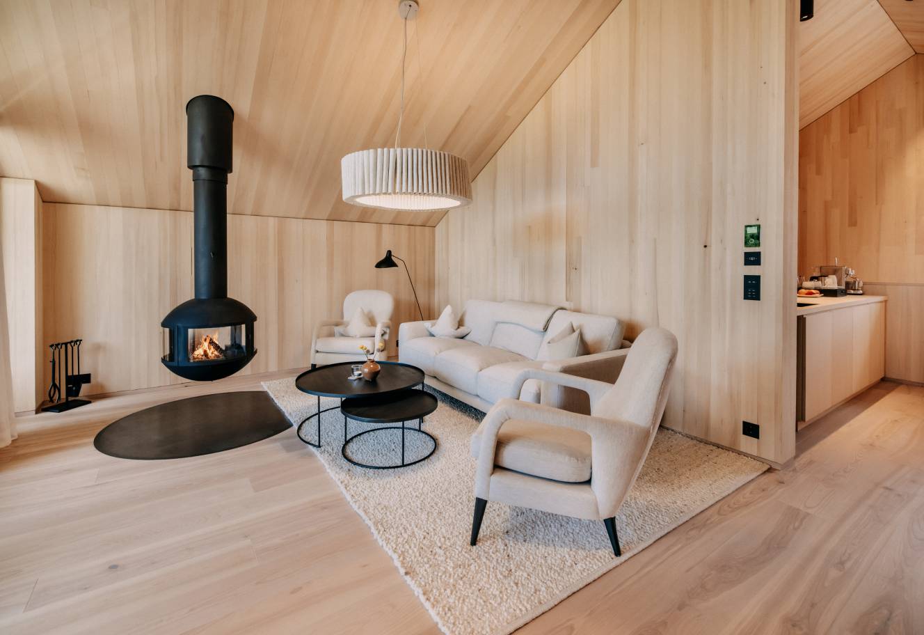 Garden loft with a floating fireplace in the Naturhotel Forsthofgut