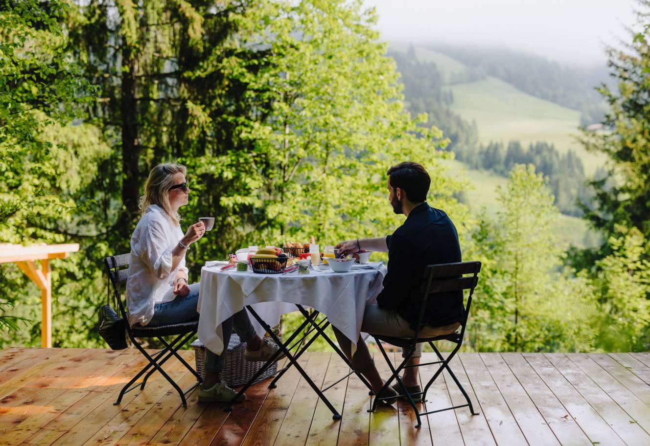 Yoga retreat at the Forsthofgut - Woman doing yoga in the woods