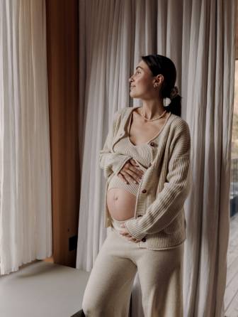 Babymoon – pregnant woman relaxing and enjoying her getaway.