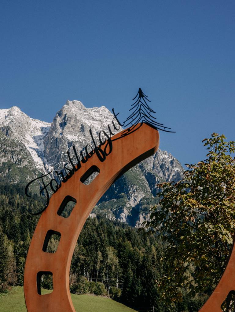 Riding stable in the mountains – Forsthofgut equestrian center horseshoe sculpture
