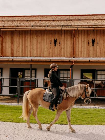 Woman on horse at the Forsthofgut riding stables