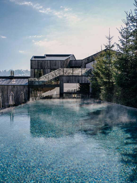 Enjoy wellness and sun - the outdoor pool at the Spa Hotel Forsthofgut in Austria