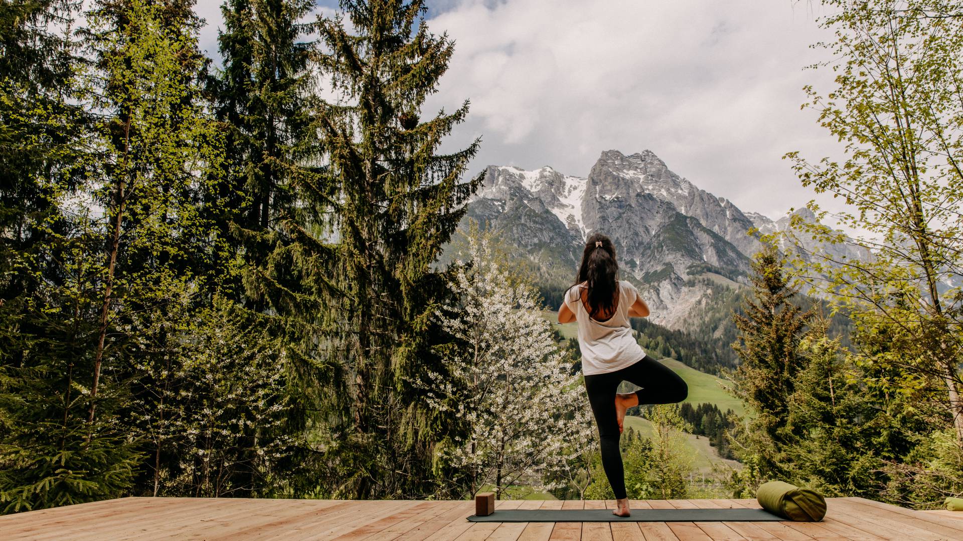 Summer holiday relaxation - woman on yoga platform
