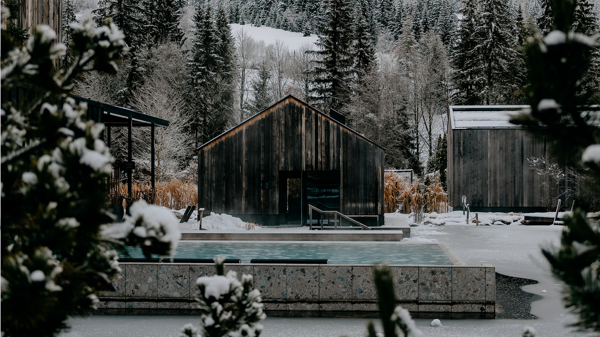 The heated lake pool with views of the snowy landscape.